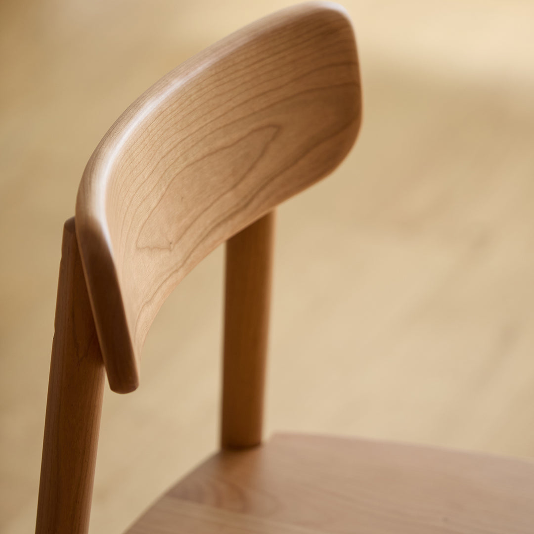 Scandinavian cherry wood dining chair green color swatches.