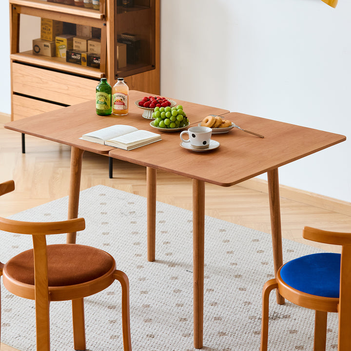 Scandinavian cherry wood dining table forest in still life.