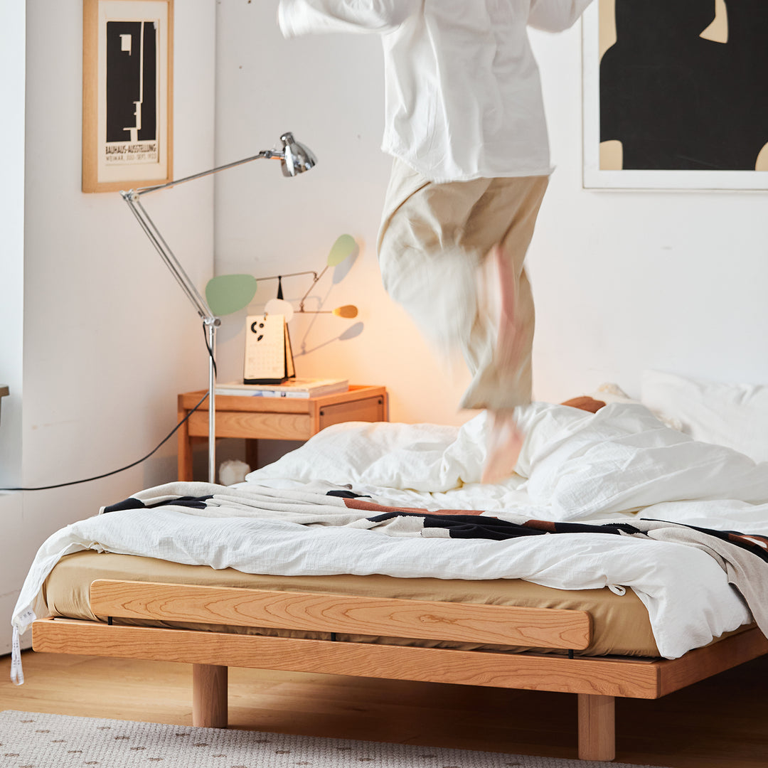 Scandinavian cherry wood platform bed small in details.