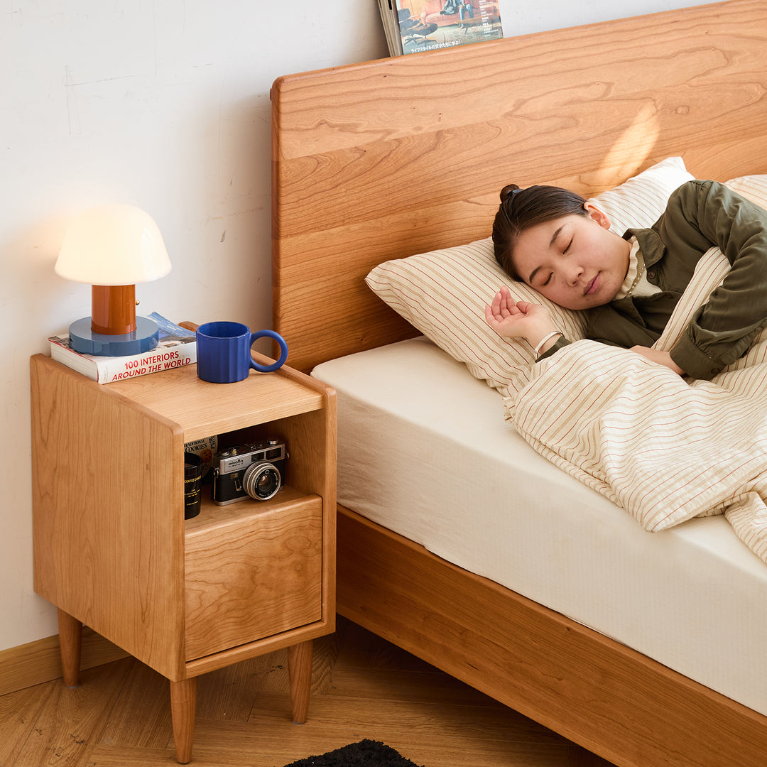 Scandinavian cherry wood side table cubo with context.
