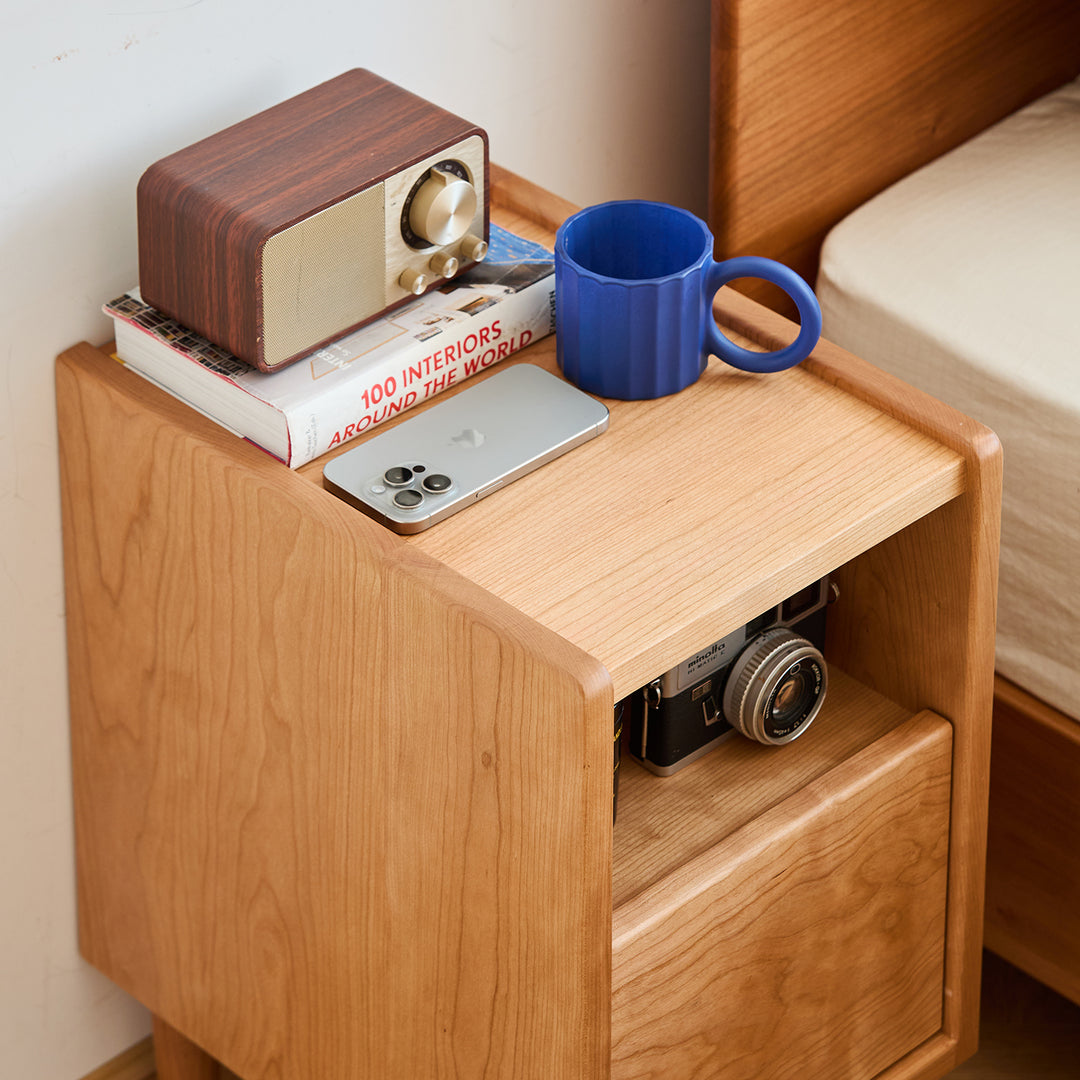 Scandinavian cherry wood side table cubo in still life.