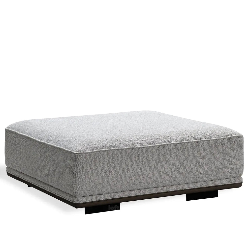 Minimalist mixed weave fabric modular ottoman eleganza in white background.
