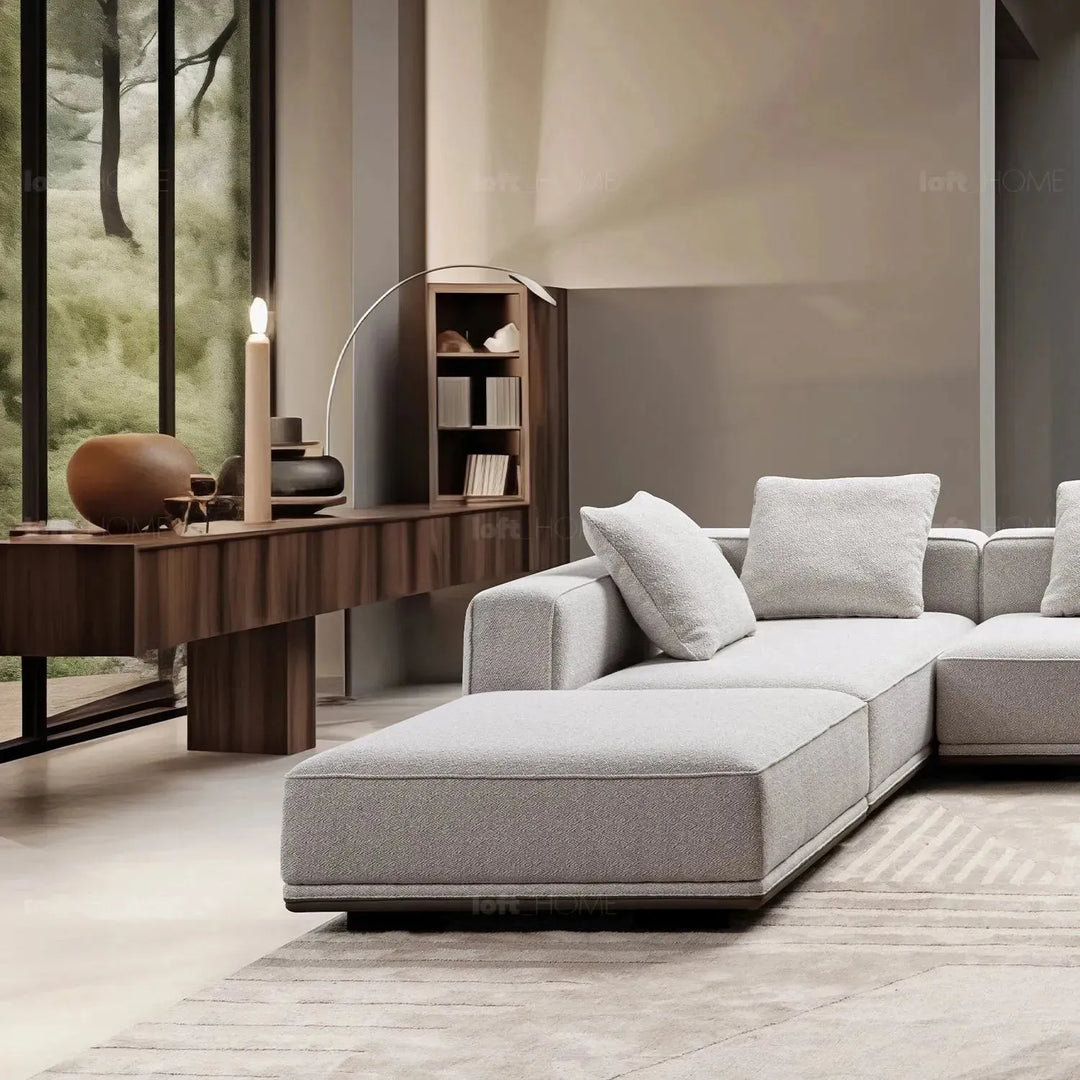 Minimalist mixed weave fabric modular ottoman eleganza with context.