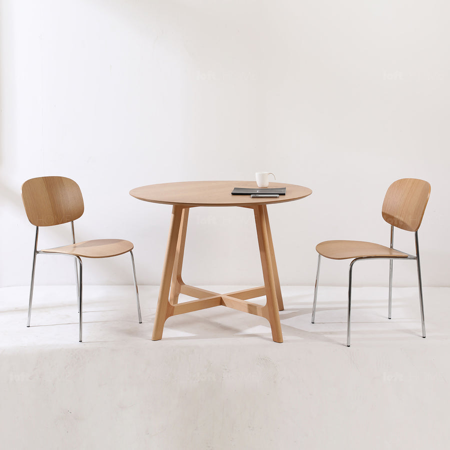 Scandinavian oak wood veneer round dining table orbit primary product view.