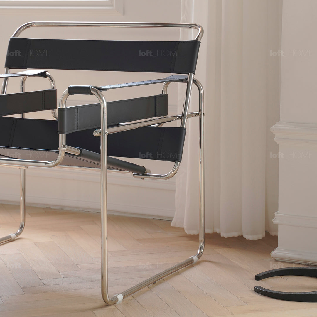 Vintage steel leather sofa chair 1 seater sofa wassily in close up details.