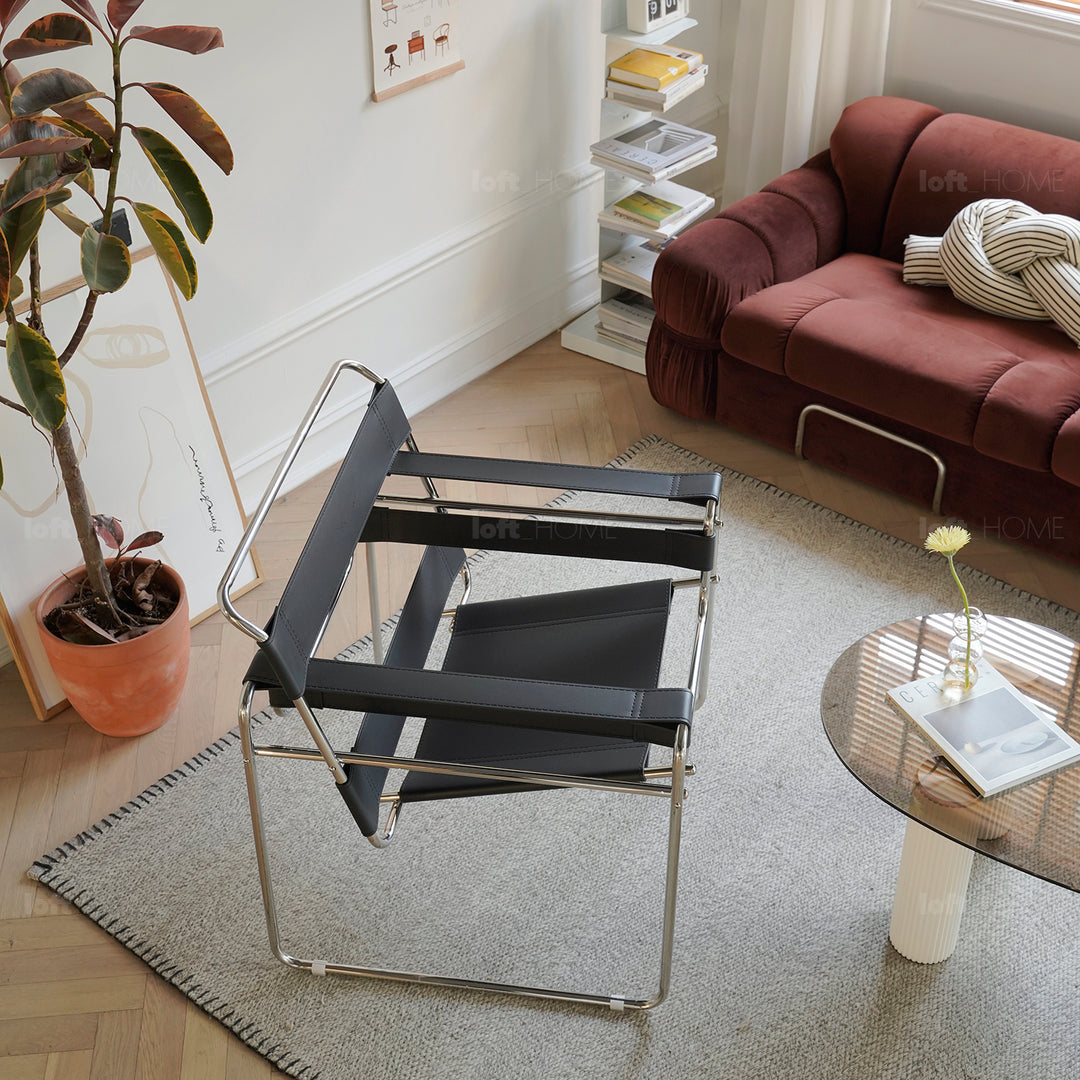 Vintage steel leather sofa chair 1 seater sofa wassily in still life.