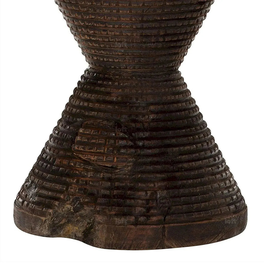 Rustic wood side table drum in close up details.