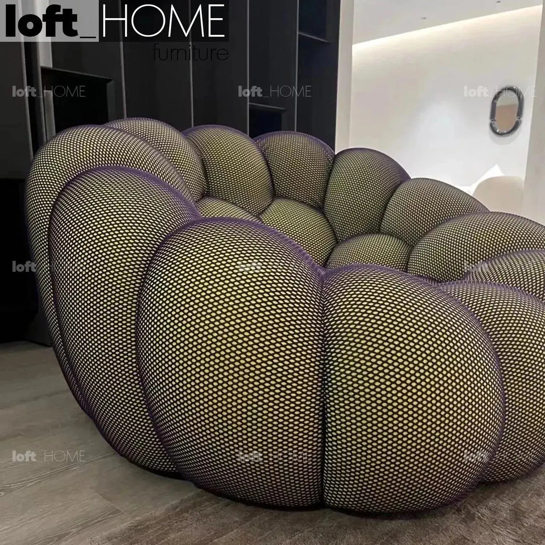 Contemporary fabric 1 seater sofa bubble in close up details.