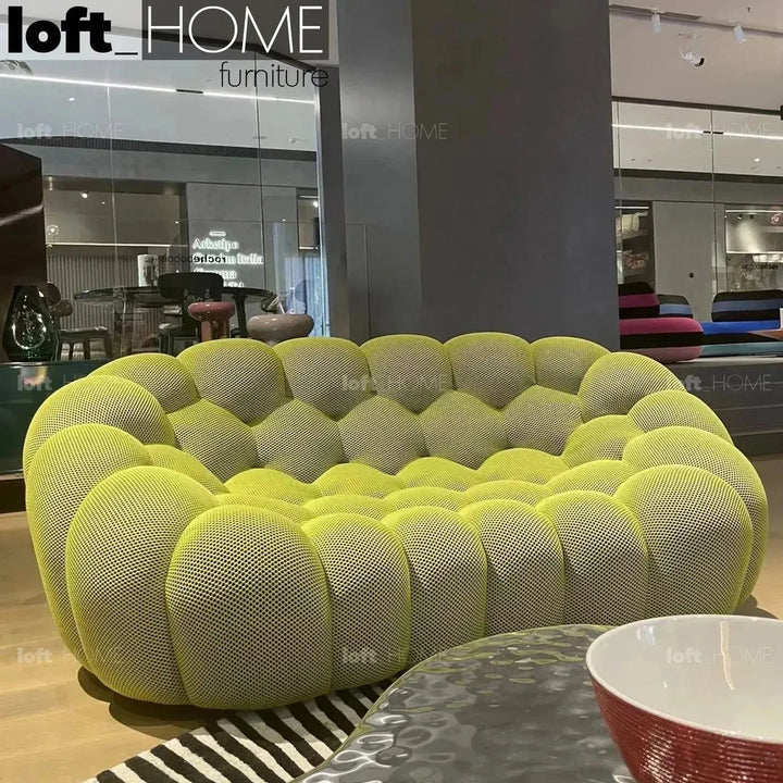 Contemporary fabric 2 seater sofa bubble in close up details.