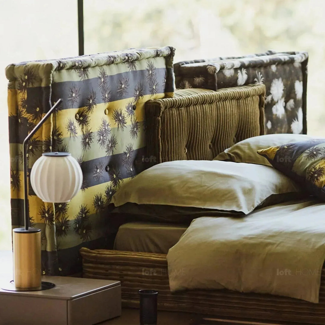 Contemporary fabric bed mahjong in still life.