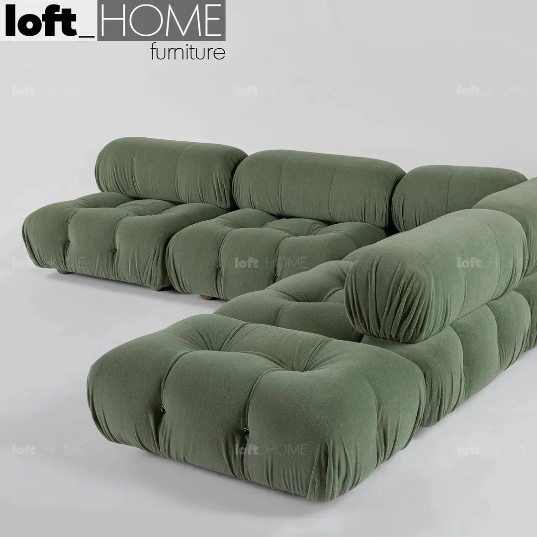 Contemporary fabric ottoman camaleonda in real life style.