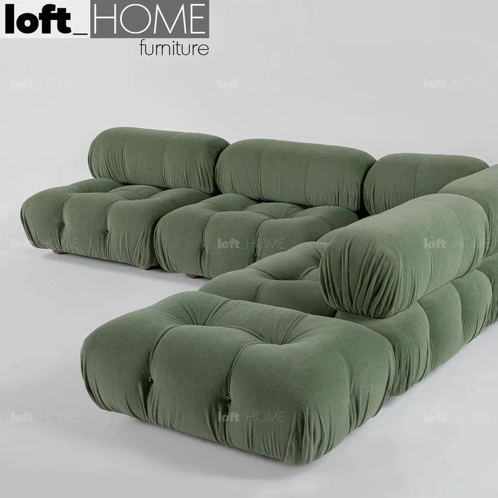 Contemporary fabric ottoman camaleonda in real life style.