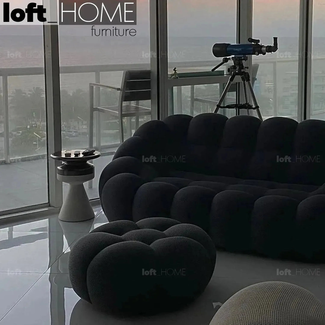 Contemporary fabric round ottoman bubble in details.