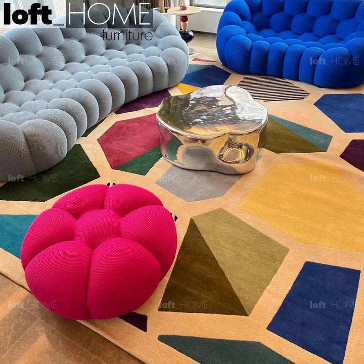 Contemporary fabric round ottoman bubble in still life.