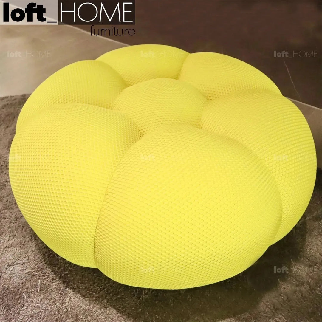 Contemporary fabric round ottoman bubble in close up details.