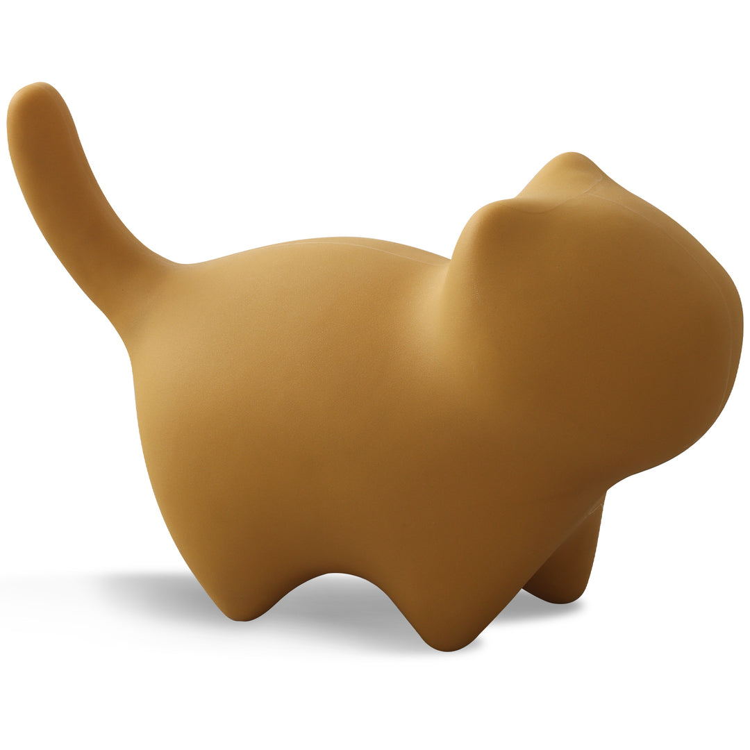 Contemporary plastic ottoman cat in still life.