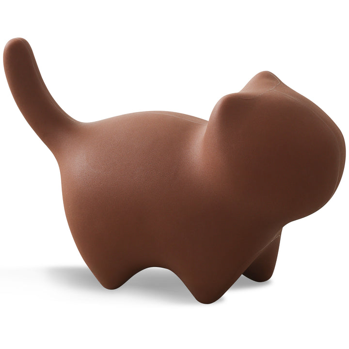 Contemporary plastic ottoman cat in white background.