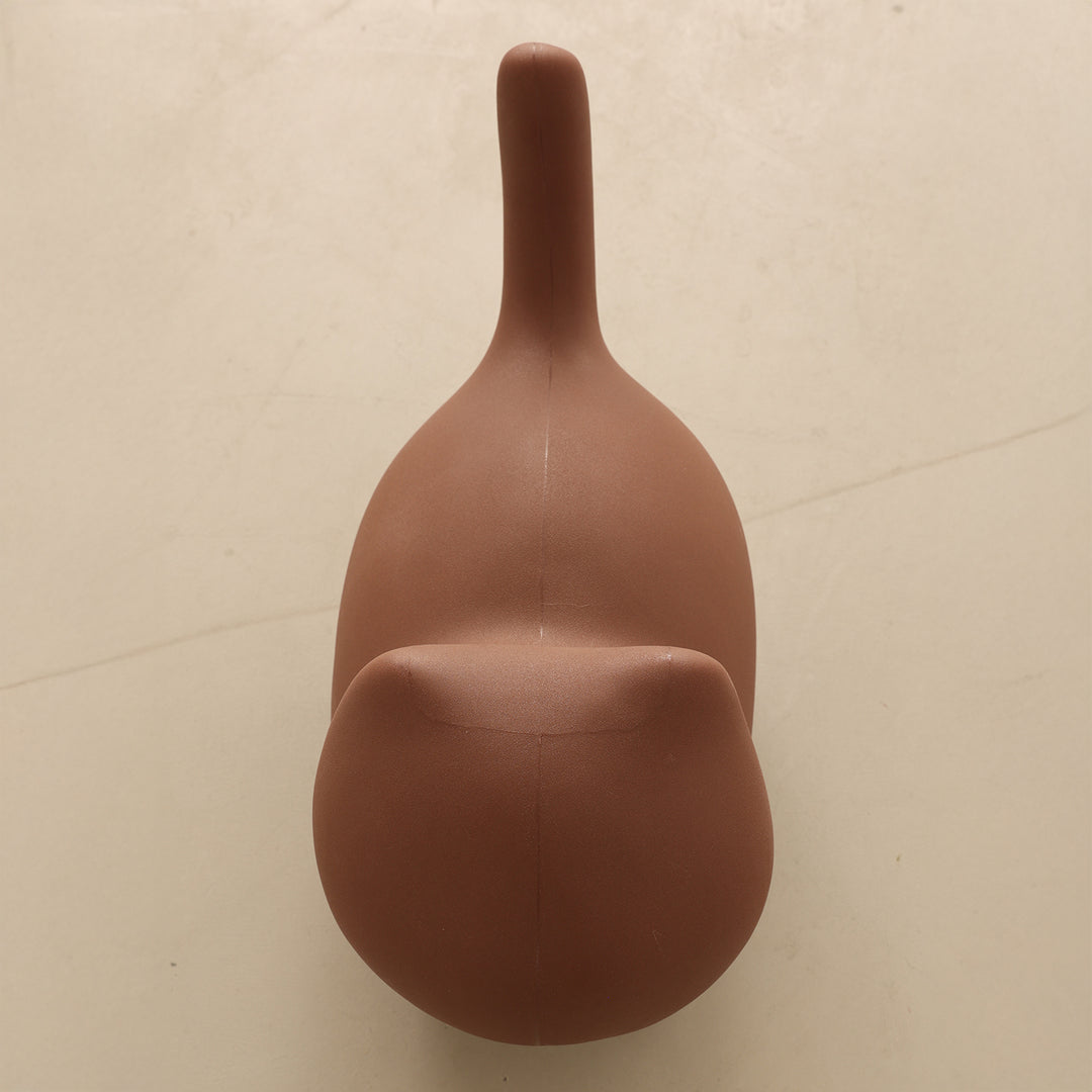 Contemporary plastic ottoman cat in real life style.