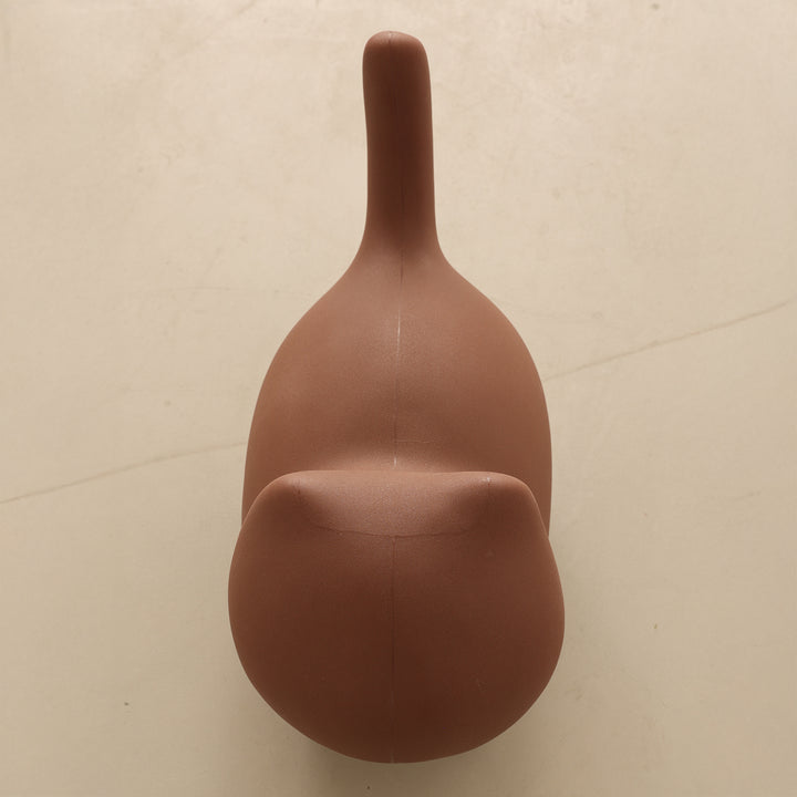 Contemporary plastic ottoman cat in real life style.