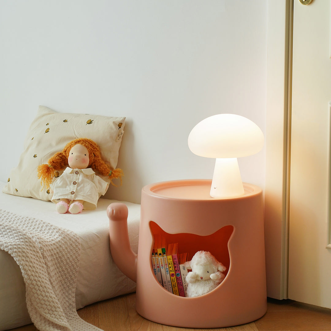 Contemporary plastic side table cat house with context.