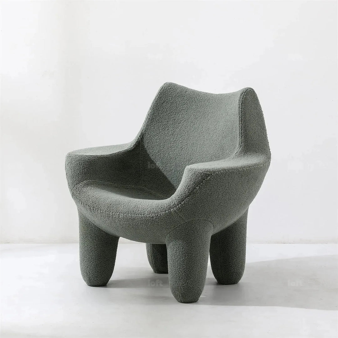 Cream boucle 1 seater sofa mibster in still life.