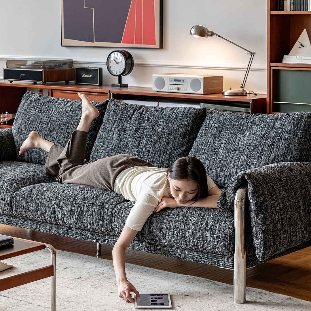 Cream boucle fabric 3 seater sofa song in close up details.