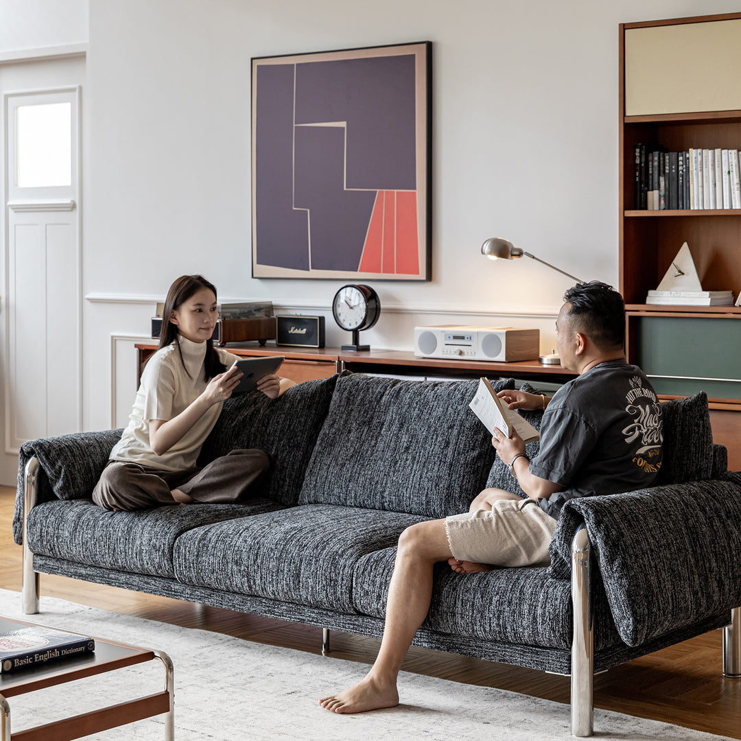 Cream boucle fabric 3 seater sofa song in panoramic view.