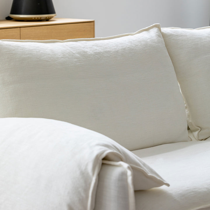 Cream cotton fabric 1 seater sofa folding ear with context.