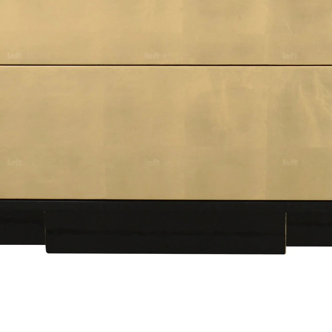 Eclectic wood drawer cabinet noirgold in still life.