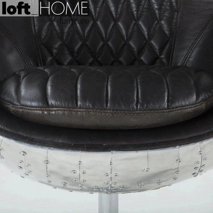 Industrial aluminium 1 seater sofa egg in still life.