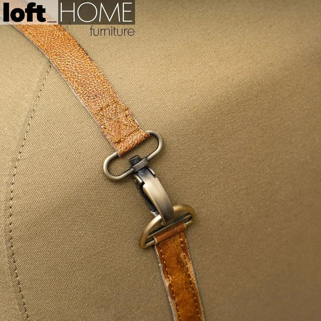 Vintage canvas ottoman stool travel with context.