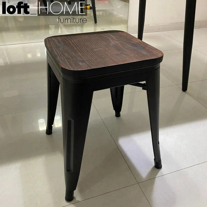 Industrial elm wood dining stool sanctum x in close up details.
