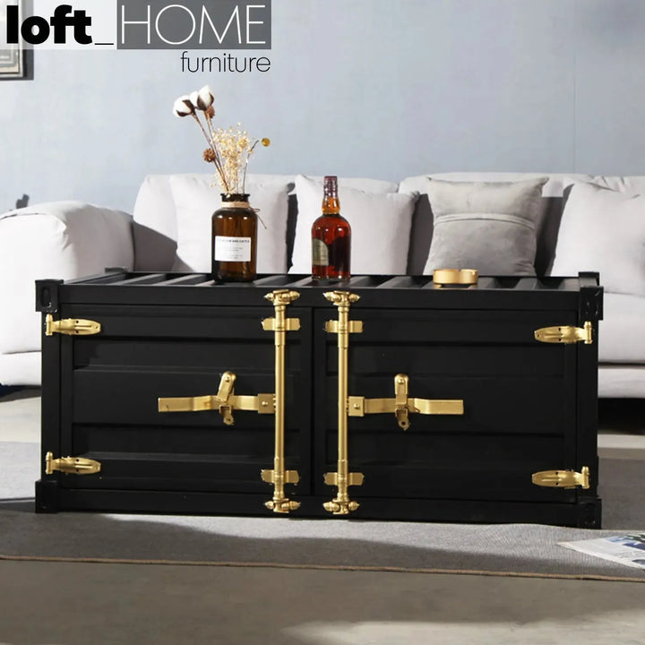 Industrial metal coffee table container with context.