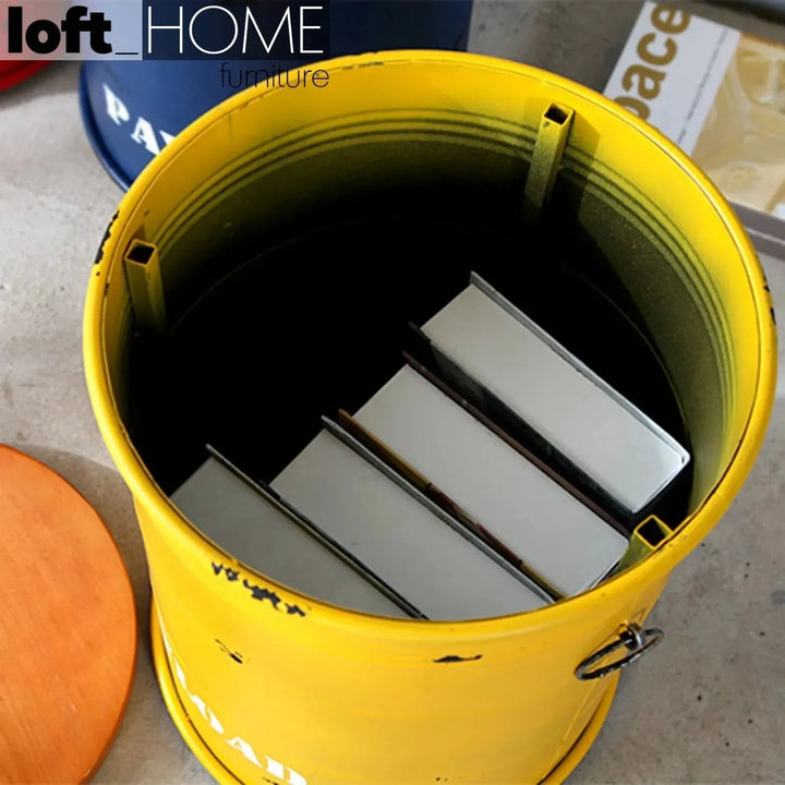 Industrial metal side table container round in close up details.