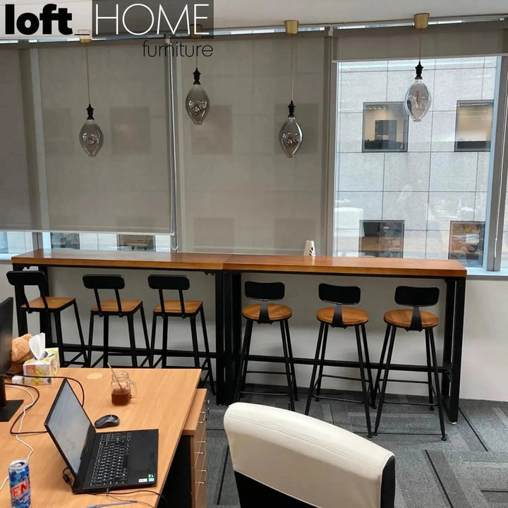 Industrial pine wood round bar chair starbuck wood in still life.