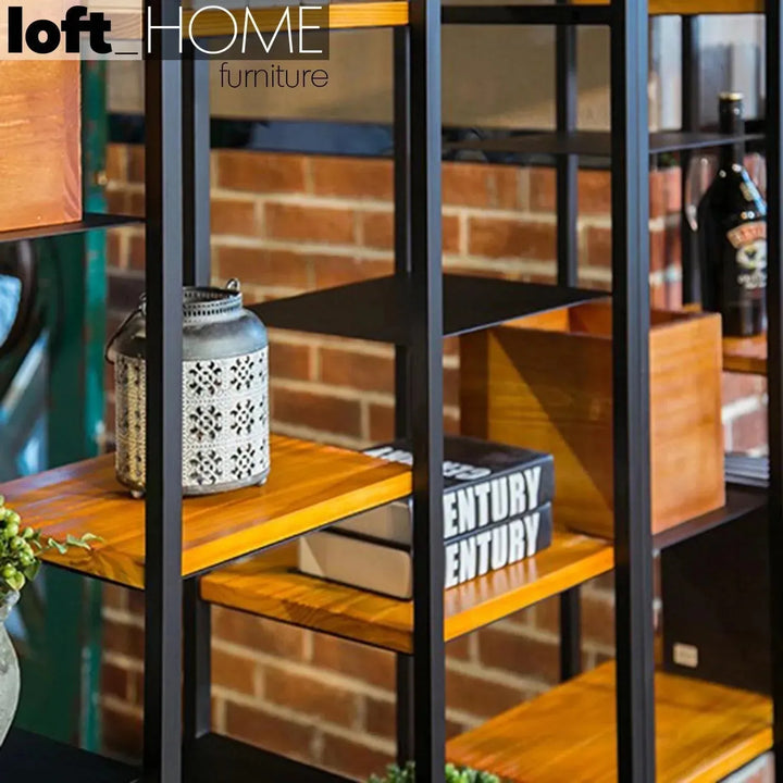 Industrial pine wood display shelf cozy in panoramic view.