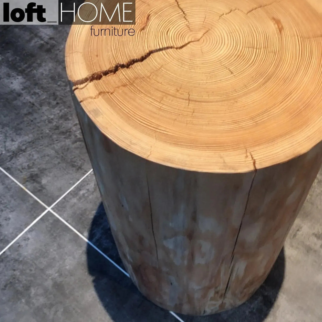 Rustic wood side table stump in details.