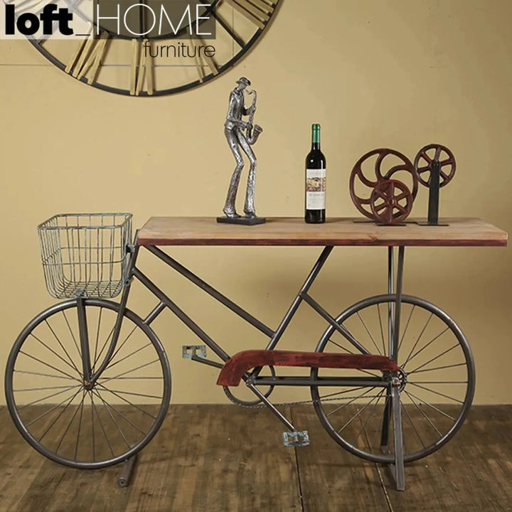 Industrial wood study table bicycle in still life.