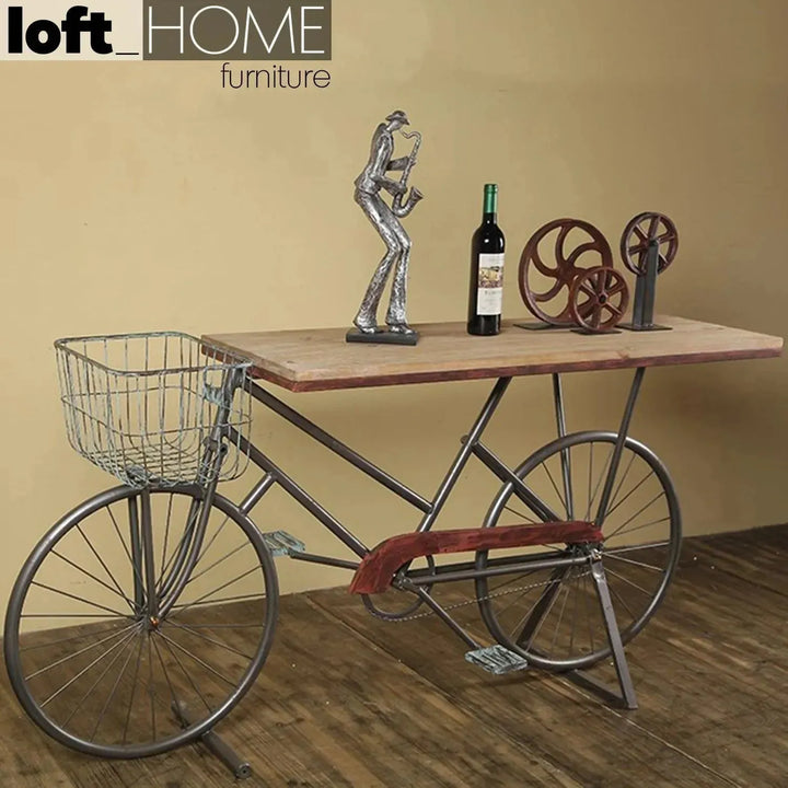 Industrial wood study table bicycle environmental situation.