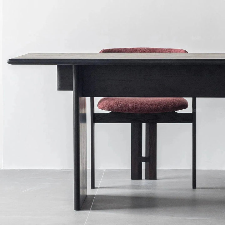 Japandi boucle fabric/leather dining chair semi circle in still life.