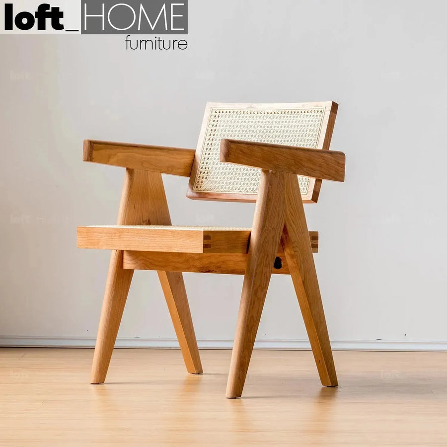 Scandinavian rattan armrest dining chair jeanneret primary product view.