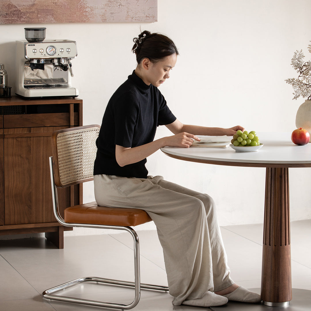 Japandi walnut wood sintered stone round dining table grey material variants.