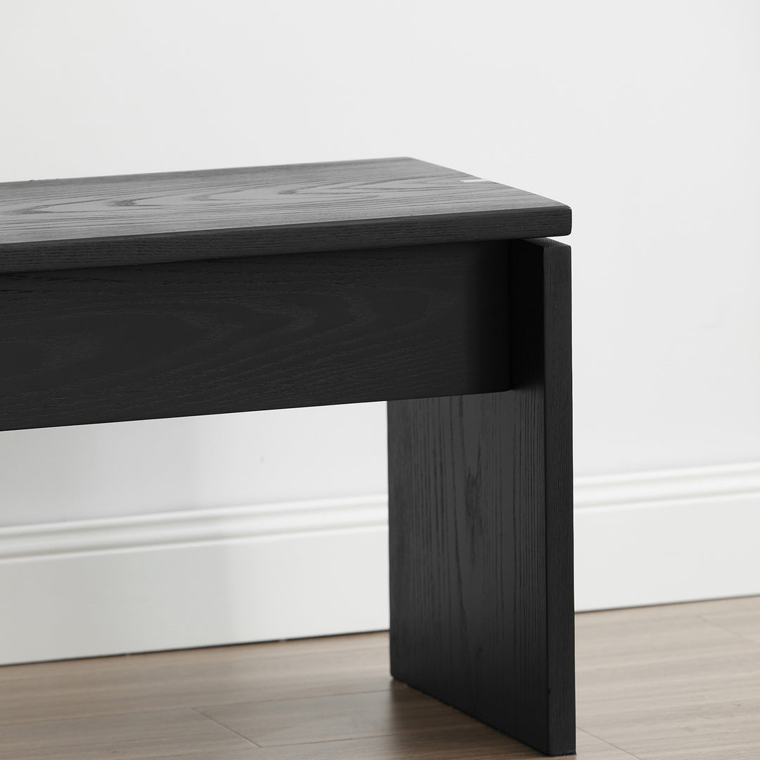 Minimalist ash wood dining bench black oslo in close up details.