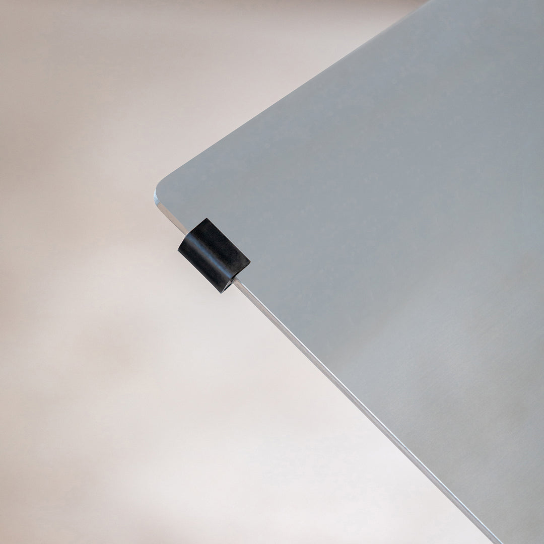 Minimalist ash wood veneer stainless steel round dining table black aeri in panoramic view.