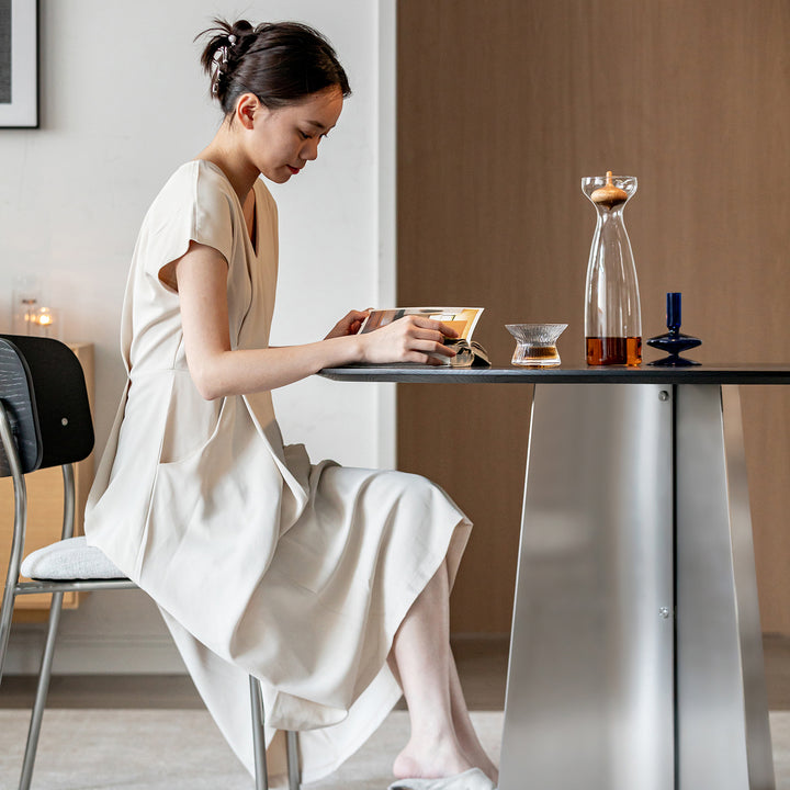 Minimalist ash wood veneer stainless steel round dining table black aeri with context.