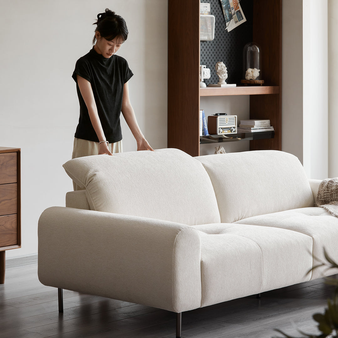 Minimalist chenille velvet fabric 1 seater sofa drift with context.