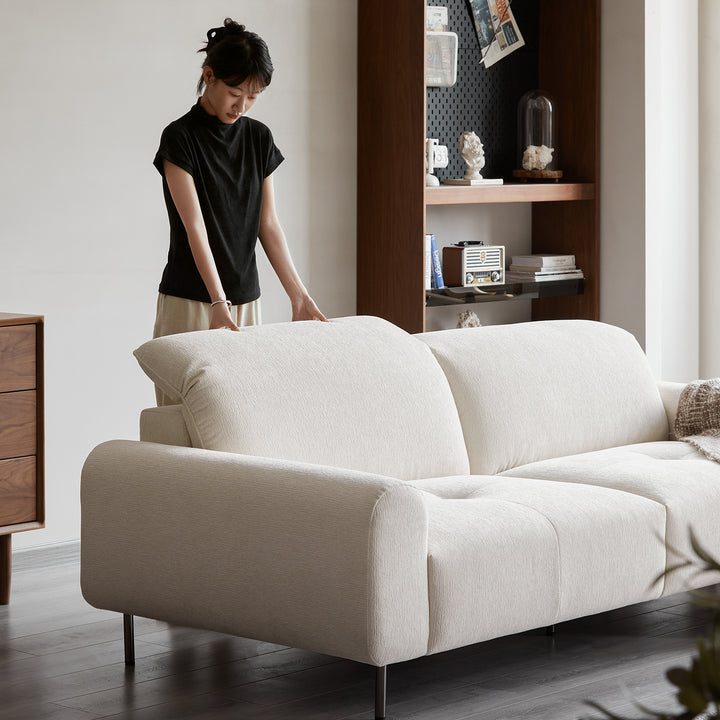 Minimalist chenille velvet fabric 1 seater sofa drift with context.