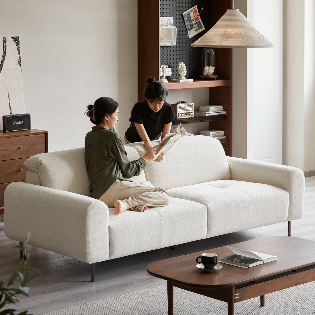 Minimalist chenille velvet fabric 3 seater sofa drift in close up details.