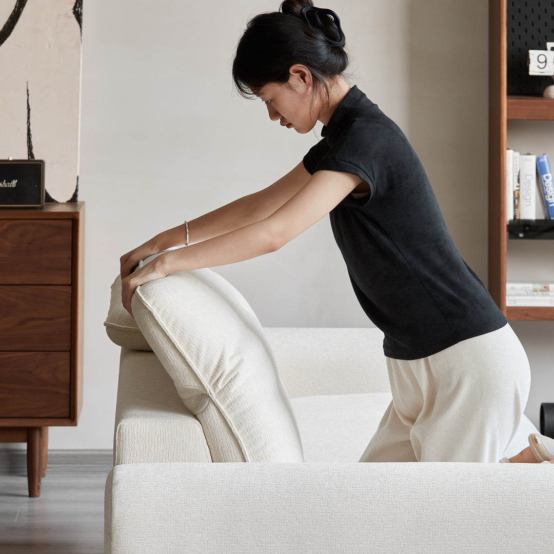 Minimalist chenille velvet fabric 3 seater sofa drift in still life.