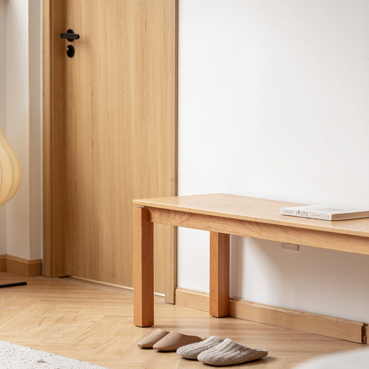 Minimalist cherry wood dining bench coastal in details.